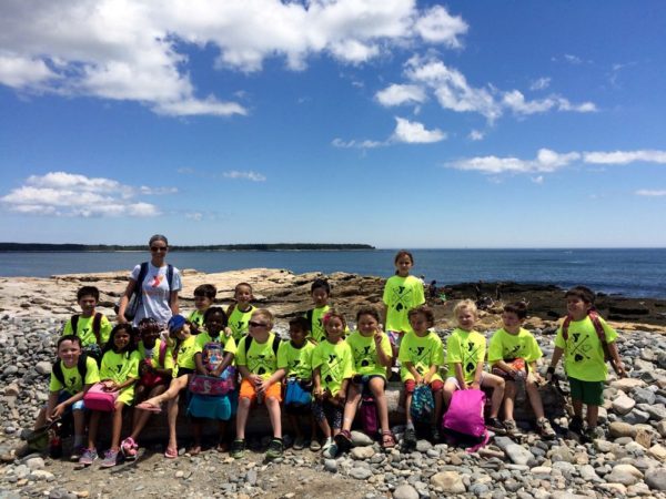 At Geddy's, we support Mount Desert Island YMCA – providing meals & activities to our kids, showing camp kids at Sand Beach.