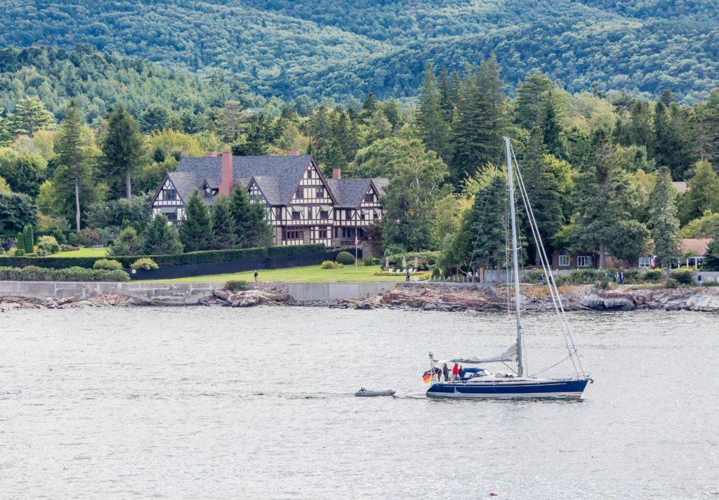 Geddy's Blog, Sailing in Bar Harbor, Maine with beautiful summer cottage in background. Photo taken from water.