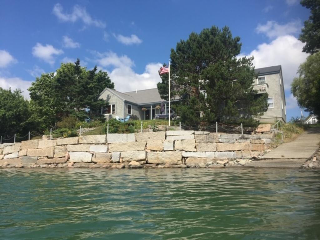 Geddys blog on Mount Desert Island real estate, showing one of the quaint waterfront properties for sale on the harbor edge.