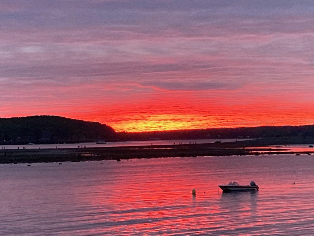 Visitors enjoy Bar Harbor's spectacular sunrises and sunsets. Sunset overlooking Frenchman Bay, Bar Harbor, Mount Desert Island